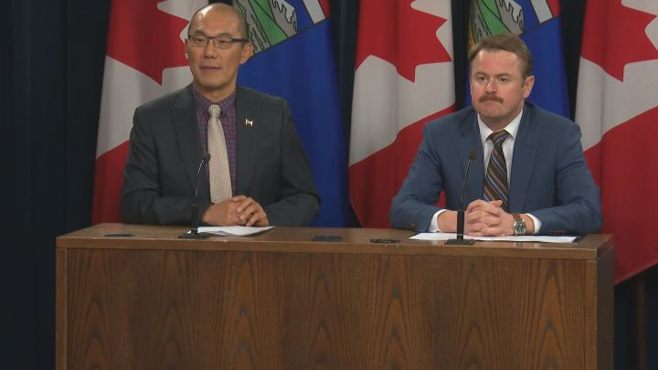 Associate Minister of Mental Health and Addictions Jason Luan (left) and Health Minister Tyler Shandro (right) speak to reporters in Edmonton on Nov. 21, 2019. 