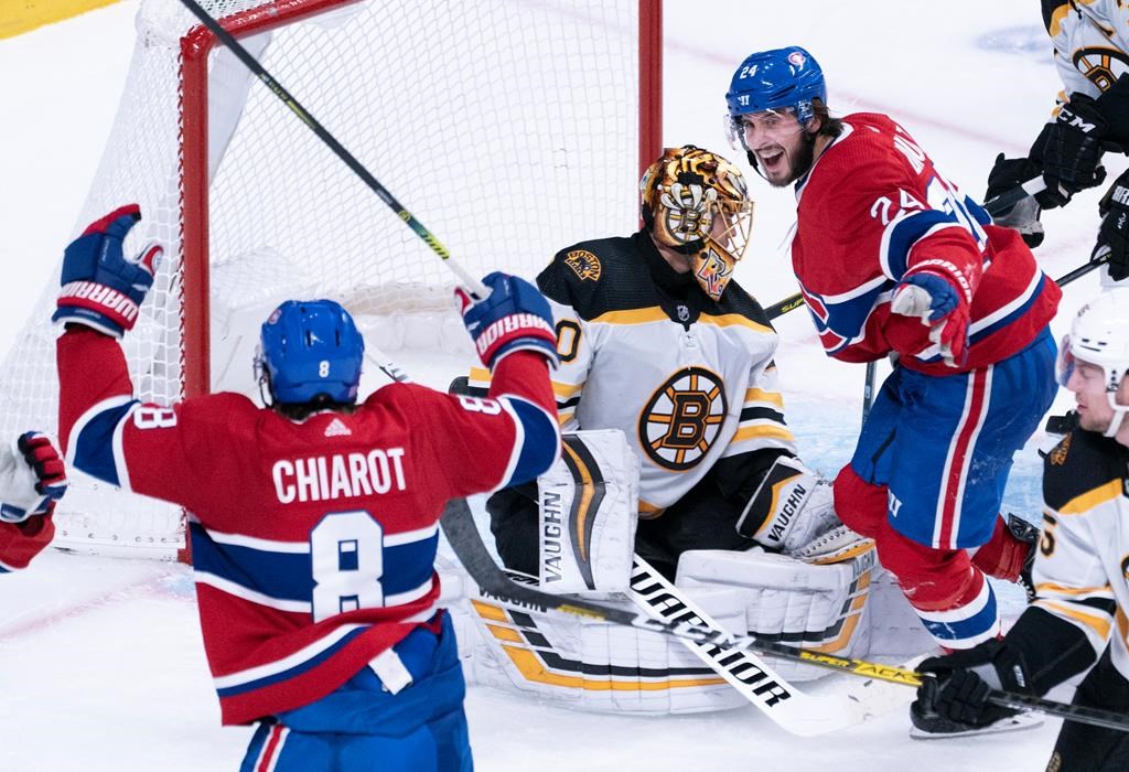 Montreal Canadiens' Phillip Danault, right, celebrates a goal by teammate Ben Chiarot, not shown, past Boston Bruins goaltender Tuukka Rask during third period NHL hockey action in Montreal on Tuesday, November 5, 2019. THE CANADIAN PRESS/Paul Chiasson.