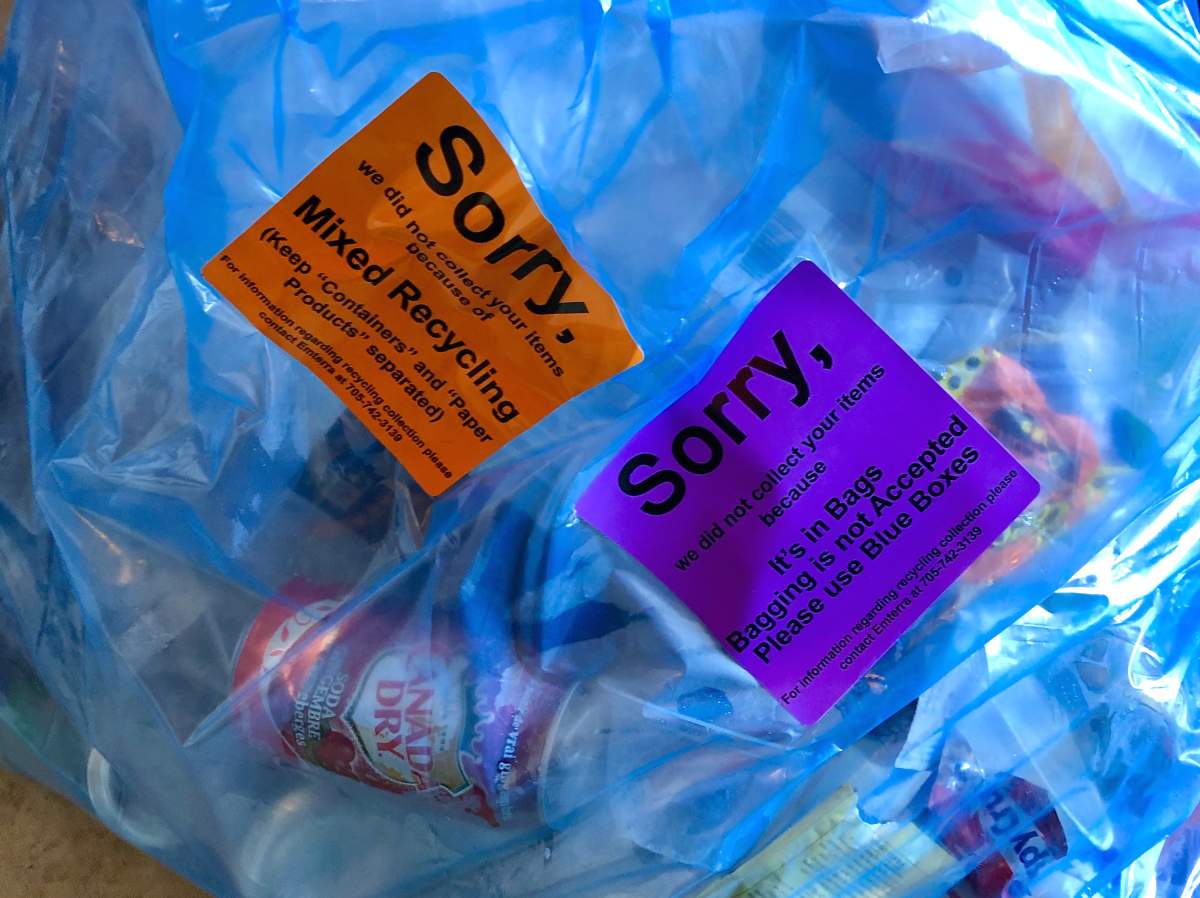 A Peterborough woman is accused of assaulting a recycling worker.