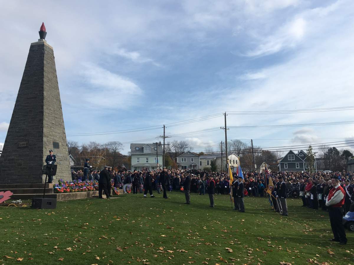 Civilians and military members lay down wreaths at the Sullivan’s Pond Cenotaph in Dartmouth, N.S. on Remembrance Day.