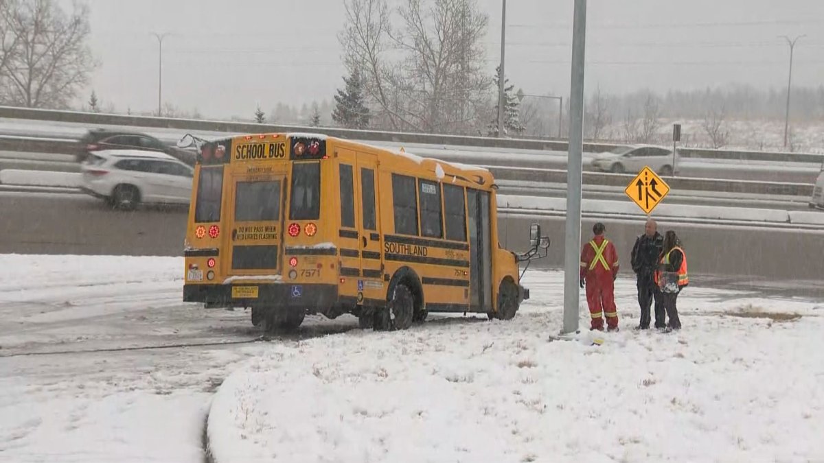 Crews are seen at the scene of a school bus crash in southwest Calgary on Tuesday, Nov. 19. 
