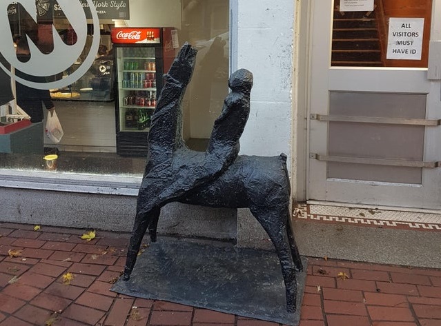 A stolen, 113-kilogram bronze sculpture sits outside a Gastown pizza place after being recovered by police. 