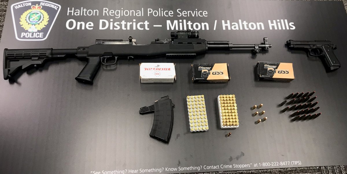 Police seized weapons and ammunition after conducting a search warrant at a home in Milton.