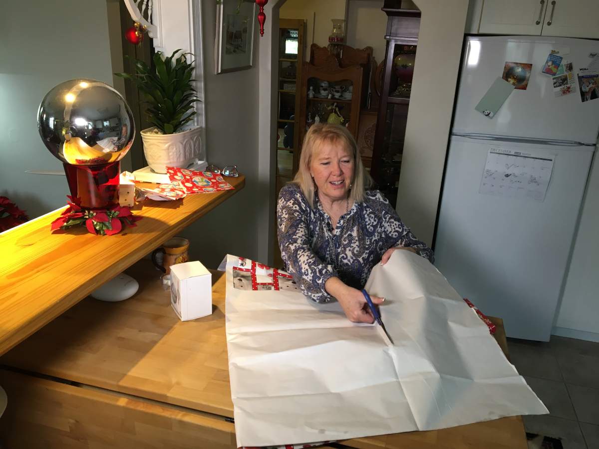 Judy wrapping Christmas gifts.