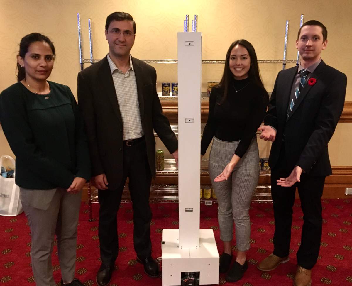 SMU students showcase their autonomous retail inventory tracking robot.