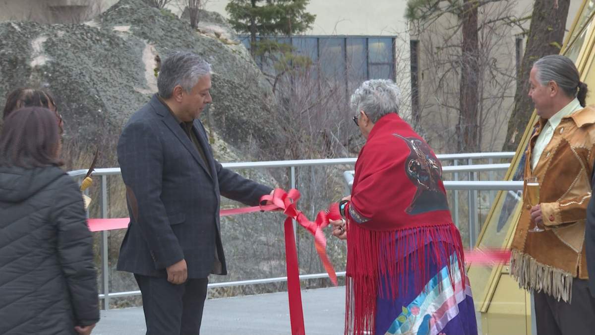 Okanagan Indian Band Chief, Bryon Louis, Elder Pauline Gregoire and Papachala Moose Hall cutting the ribbon at Sparkling Hill Resort & Spa.