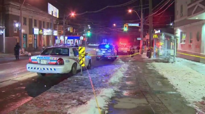 A photo of police on scene near Roncesvalles Avenue and Queen Street West.