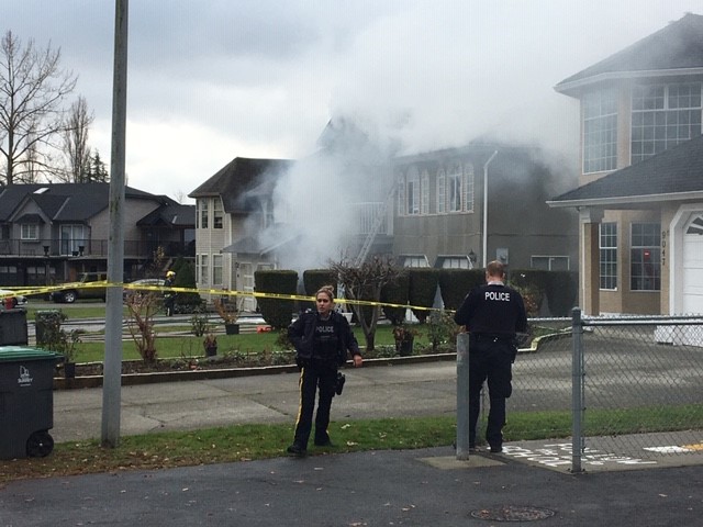 Surrey RCMP at the scene of a fatal house fire on Monday. 