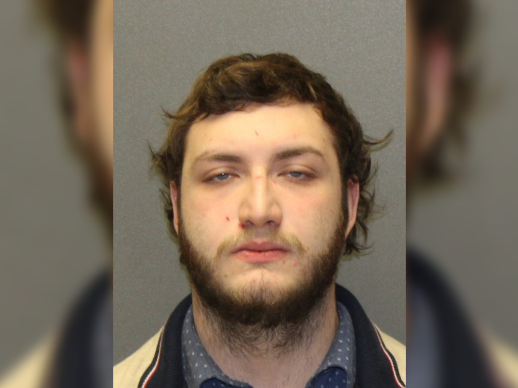 A bank teller was arrested in connection to a home invasion involving a bank's customer on Nov. 11.