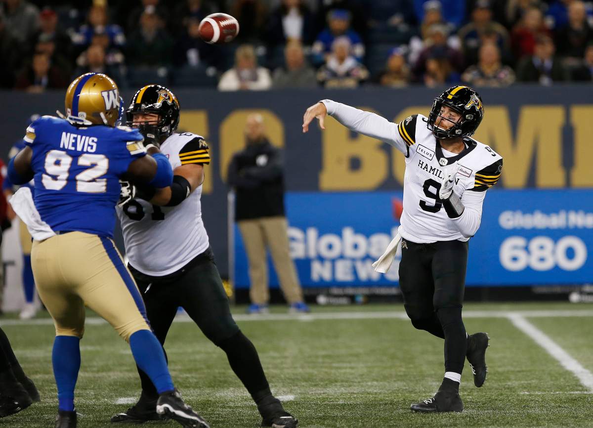 Hamilton Tiger-Cats quarterback Dane Evans (9) throws against the Winnipeg Blue Bombers during the first half of CFL action in Winnipeg on Friday, September 27, 2019.