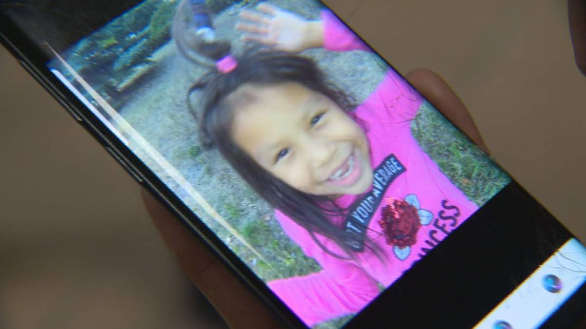 Alma Rope shows a cellphone picture of Skyrah playing at a Regina park.