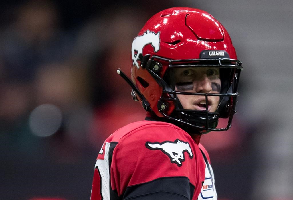 Calgary Stampeders quarterback Bo Levi Mitchell looks on during first half CFL football action against the B.C. Lions, in Vancouver, Saturday, Nov. 2, 2019.