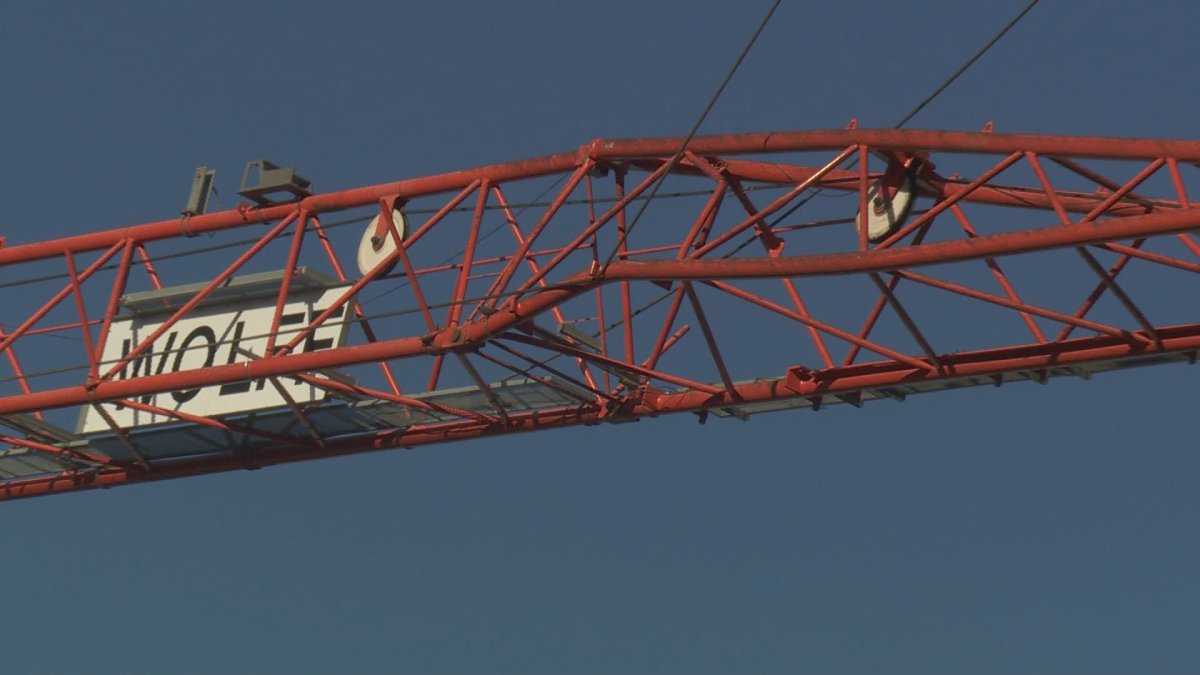 Pictures from the scene show a bent steel strut in the bottom of the crane's jib arm.