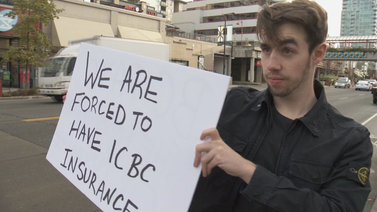 Austin Kovacs, 19, protests outside ICBC headquarters in North Vancouver on Friday. 