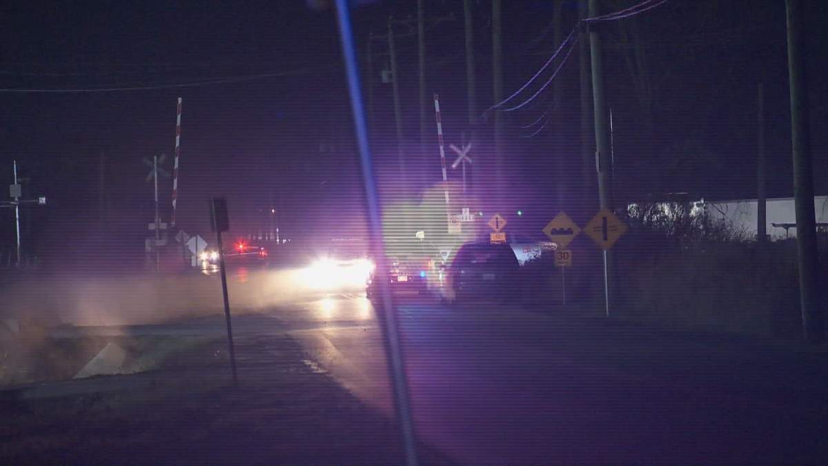 RCMP investigate a collision between a train and a pedestrian in Surrey on Wednesday. 