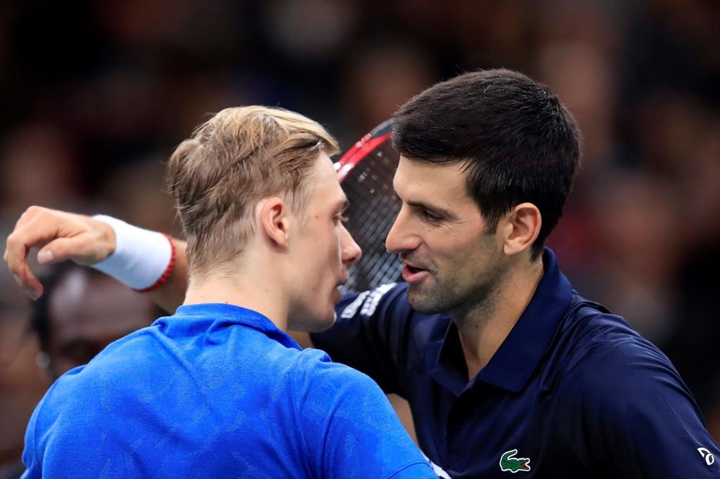 Novak Djokovic of Serbia greets Denis Shapovalov of Canada, left, after winning the final match of the Paris Masters tennis tournament in Paris, Sunday, Nov. 3, 2019. Djokovic defeated Shapovalov of Canada 6-3/6-4.