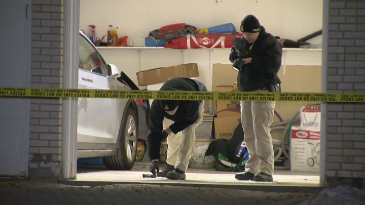 Investigators at the scene of the alleged carjacking Friday.