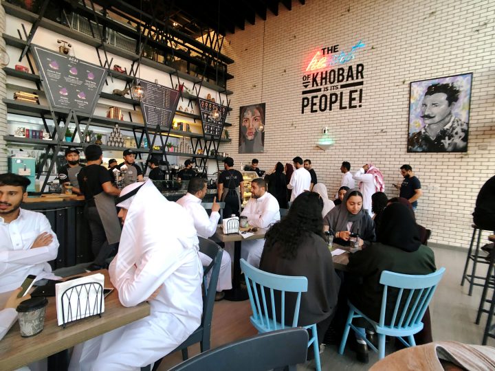 FILE PHOTO: Women sit among men in a newly opened cafe in Khobar, Saudi Arabia, August 2, 2019. 
