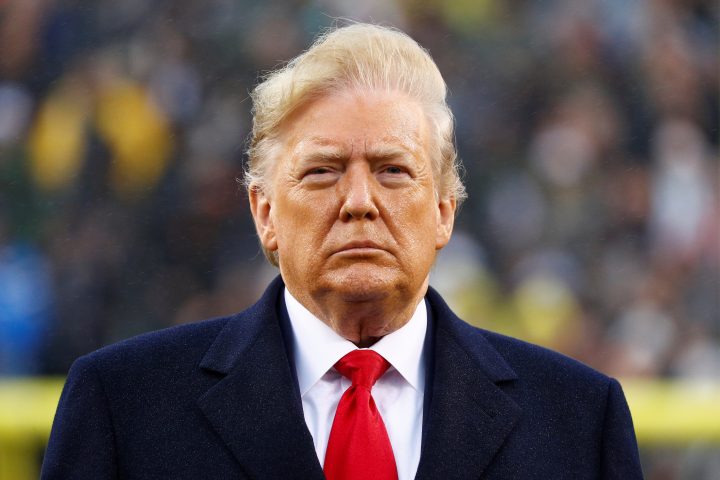 U.S. President Donald Trump stands during the playing of the national anthem, during the annual Army-Navy collegiate football game at Lincoln Financial Field in Philadelphia, PA, U.S., Dec. 14, 2019. 