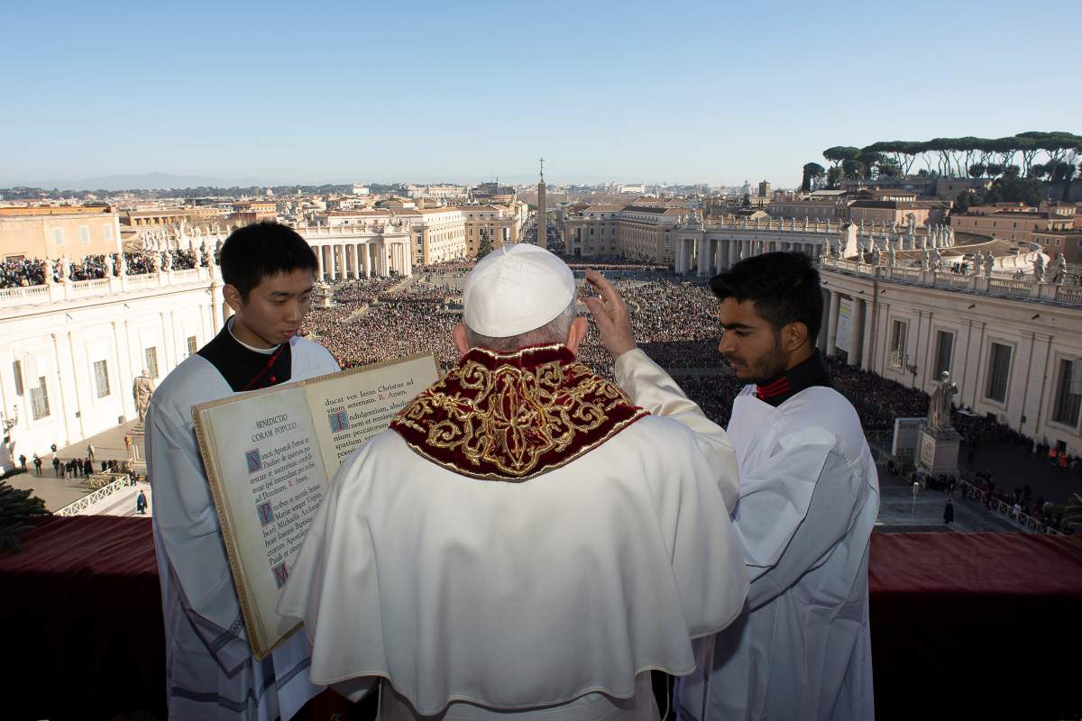 Pope Francis delivers the “Urbi et Orbi” message from the main balcony of St. Peter’s Basilica at the Vatican, December 25, 2019.