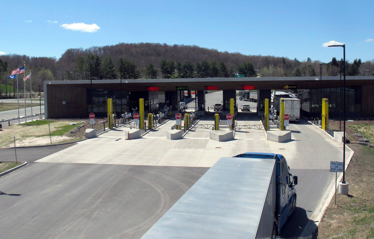 Trucks go through the U.S. border post at the crossing facility at Derby Line, Vt., in a May 8, 2019, file photo.