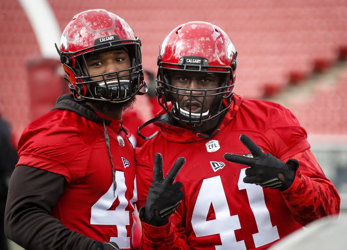 Calgary Stampeders' Cordarro Law, right, and Wynton McManis, ham it up or the camera during the first day of training camp in Calgary, Sunday, May 19, 2019.
