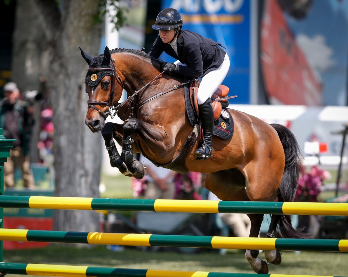 Canada's Nicole Walker rides Falco van Spieveld, during the Grand Prix event of the National at Spruce Meadows in Calgary, Saturday, June 8, 2019. THE CANADIAN PRESS/Jeff McIntosh.