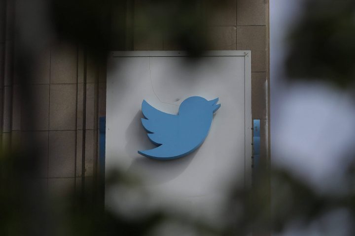 FILE - This July 9, 2019, file photo shows a sign outside of the Twitter office building in San Francisco. The Saudi government recruited two Twitter employees to get personal account information of their critics, prosecutors said Wednesday, Nov. 6, 2019. (AP Photo/Jeff Chiu, File).