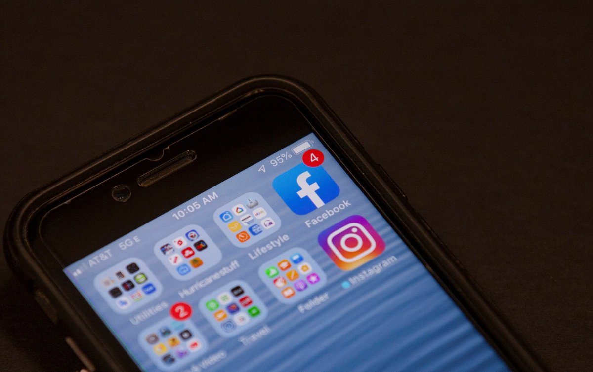 FILE - In this Oct. 29, 2019, file photo, a Facebook app is shown on a smartphone in Miami. The Competition Bureau is calling for transparency in social media "influencer" marketing.