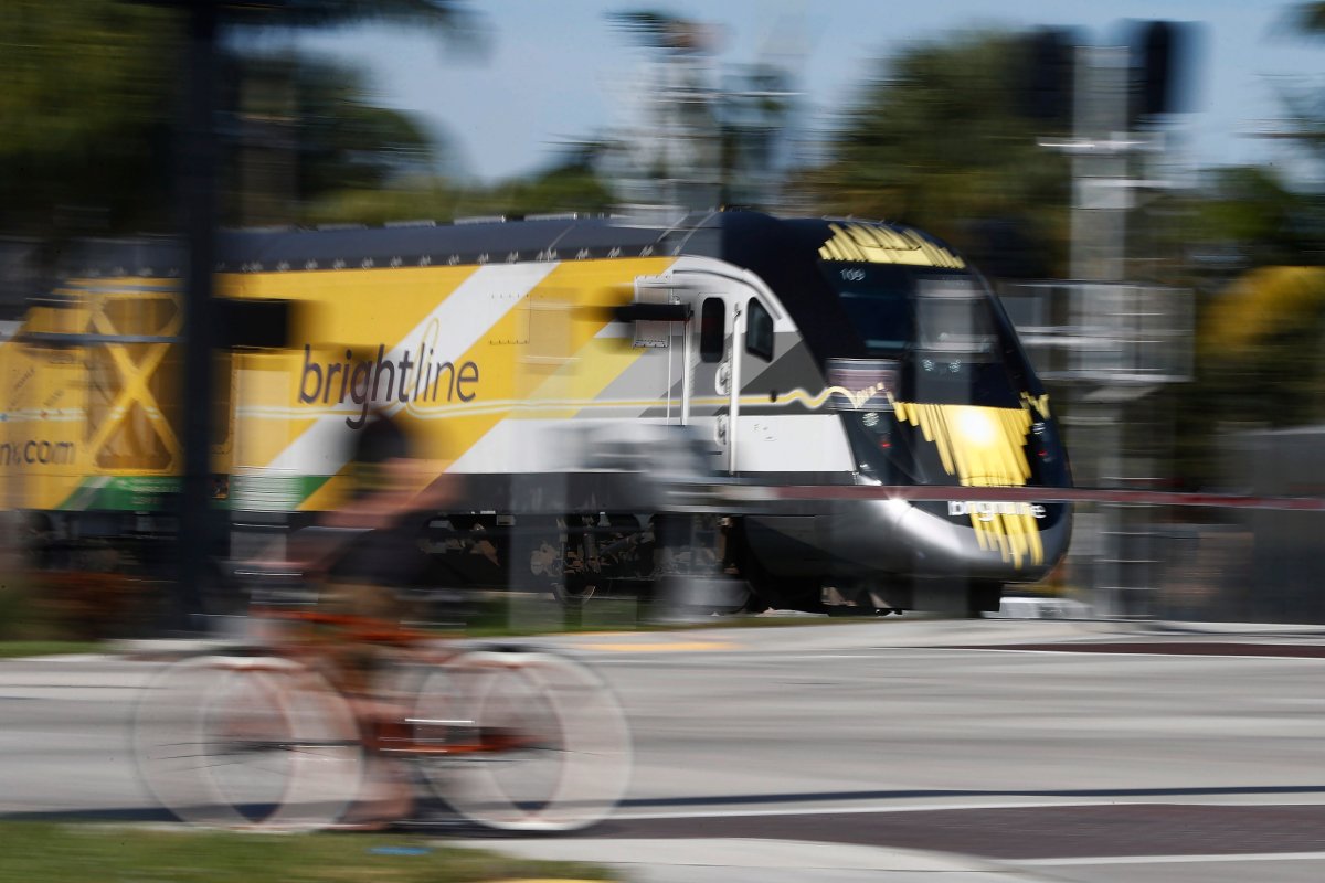 A Brightline passenger train passes by on Wednesday, Nov. 27, 2019, in Oakland Park, Fla.