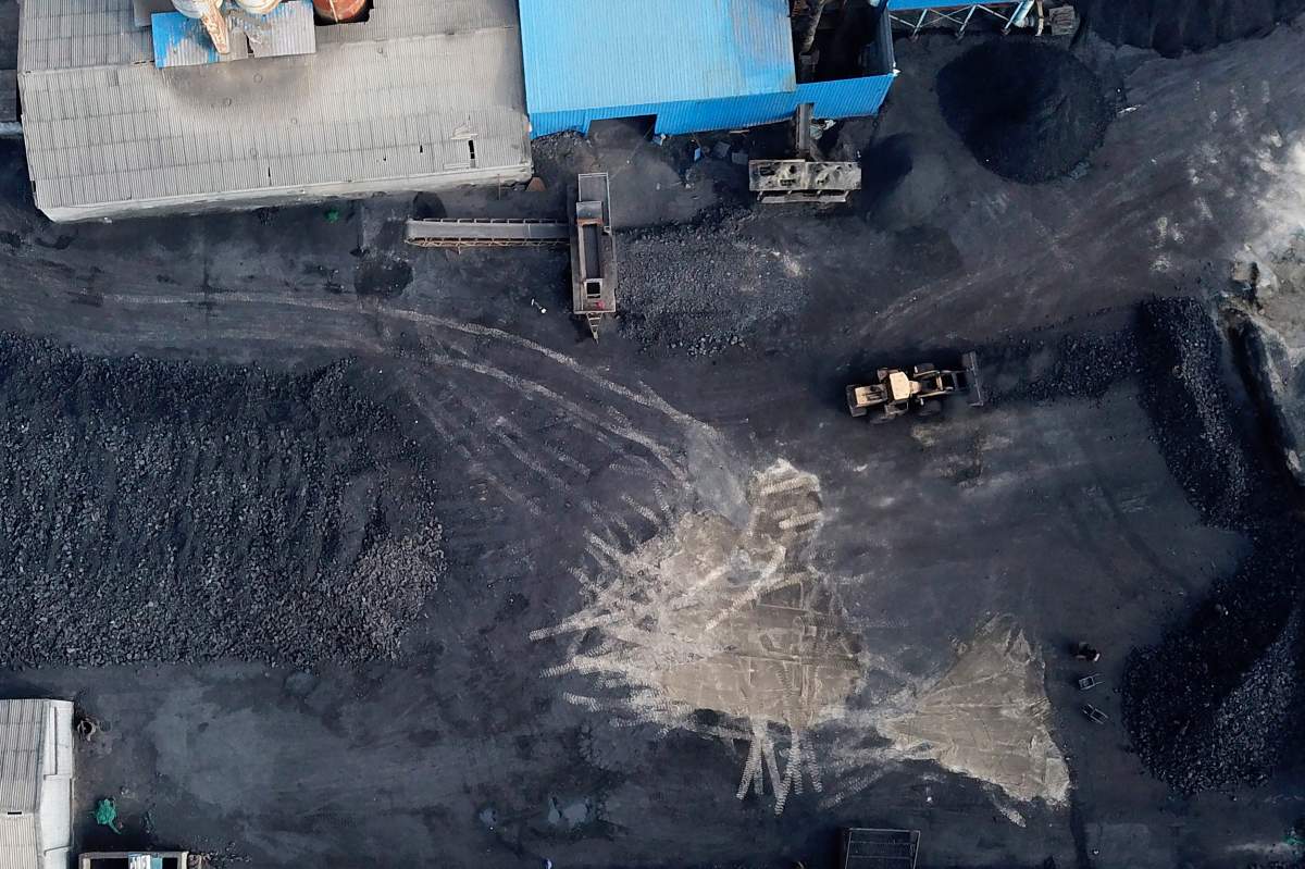 In this Nov. 28, 2019, photo, a coal storage facility is seen in Hejin in central China’s Shanxi Province.