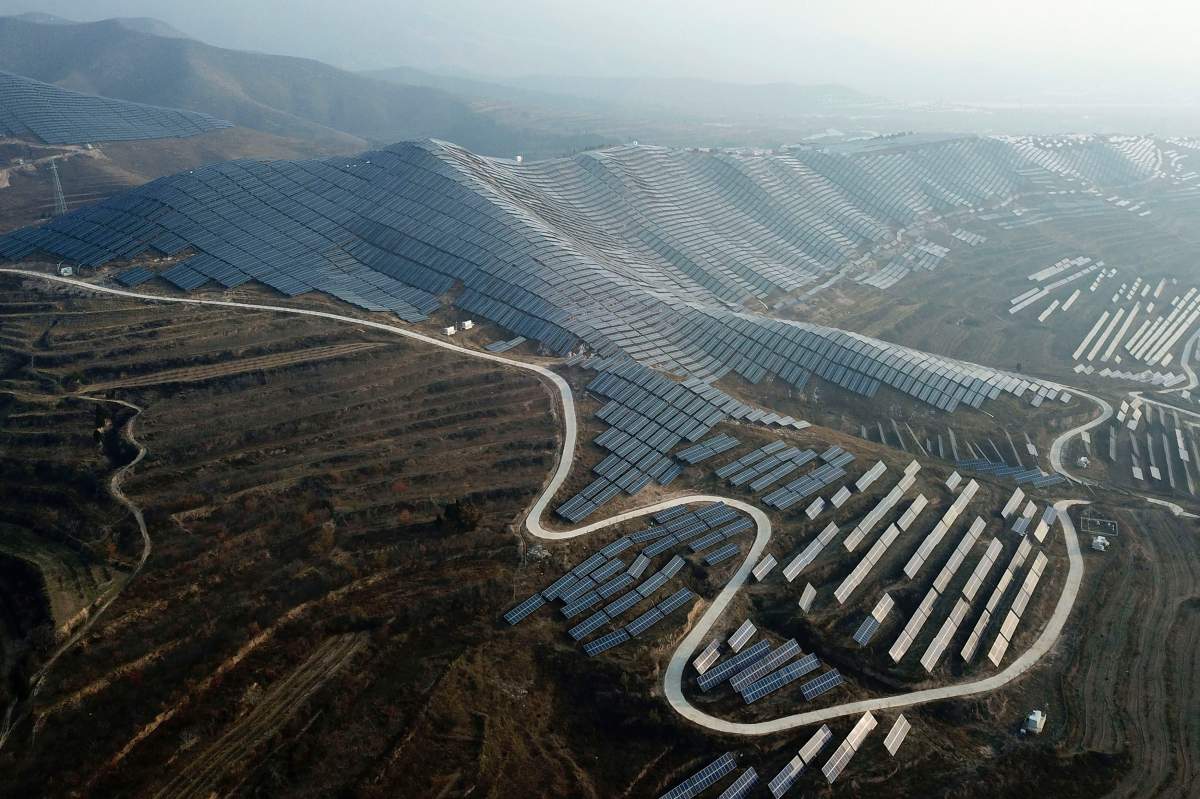 In this Nov. 28, 2019, photo, a solar panel installation is seen in Ruicheng County in central China’s Shanxi Province.