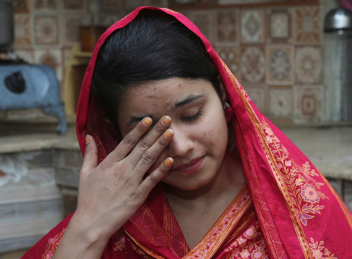 In this April 14, 2019 photo, Pakistani Christian Mahek Liaqat, who married a Chinese national, cries as she narrates her ordeal, in Gujranwala, Pakistan.