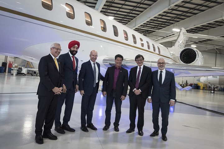 Vic Fedeli, Navdeep Bains, Alain Bellemare, Jerry Dias Howard Eng and Paul Sislian, pose for a group photograph following Bombardier Inc. press conference in Mississauga on Wednesday.