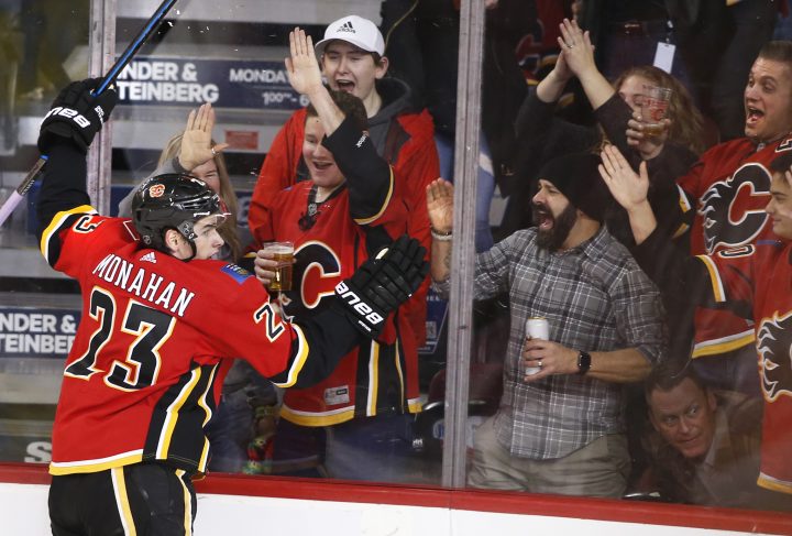 Calgary Flames’ Sean Monahan celebrates his goal with fans during second period NHL hockey action against the Los Angeles Kings, in Calgary, Alta., Saturday, Dec. 7, 2019.