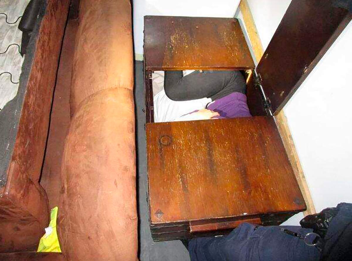 This photo released Monday, Dec. 9, 2019 by U.S. Customs and Border Protection (CBP) shows a person hiding inside a wooden chest.