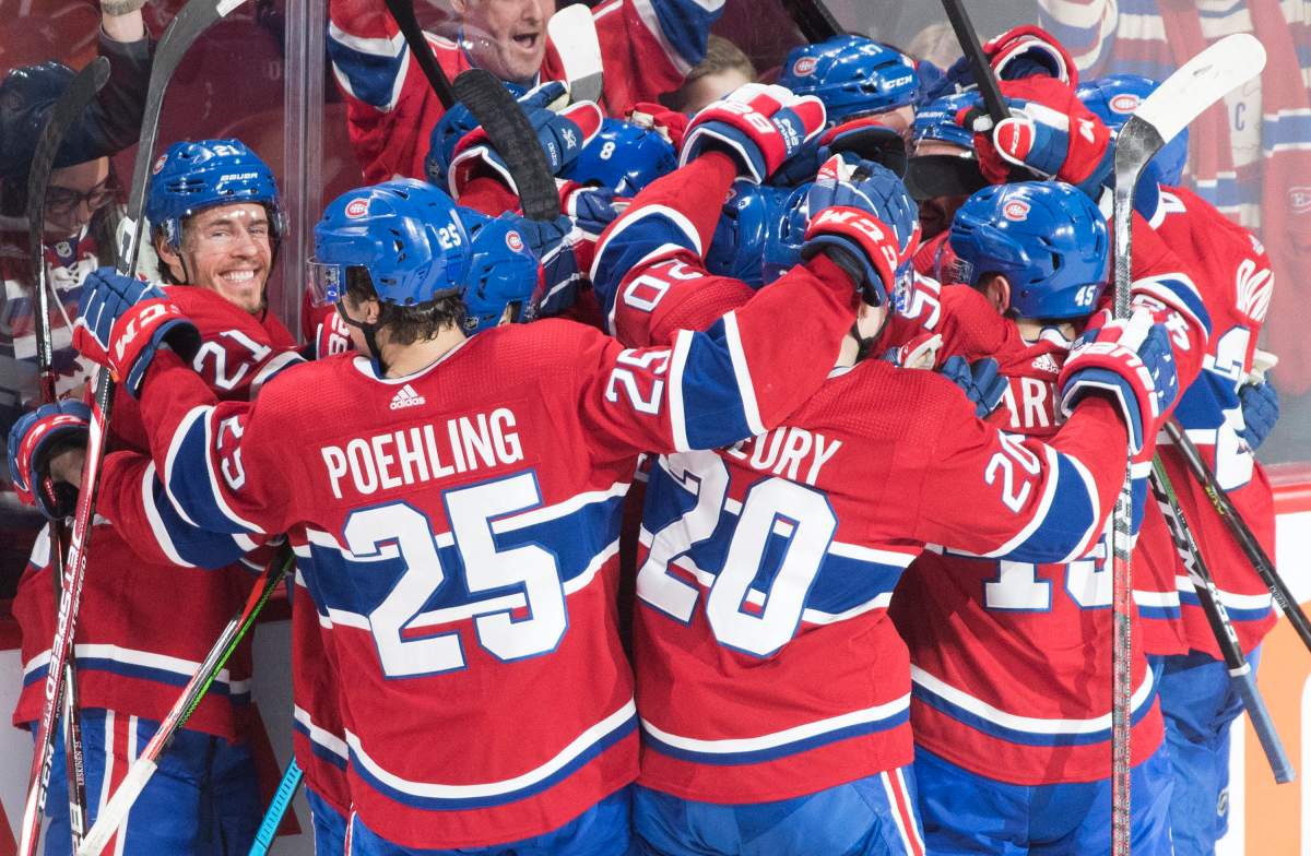 Players from the Montreal Canadiens celebrate after defeating the Ottawa Senators in an NHL hockey game in Montreal, Wednesday, December 11, 2019. 