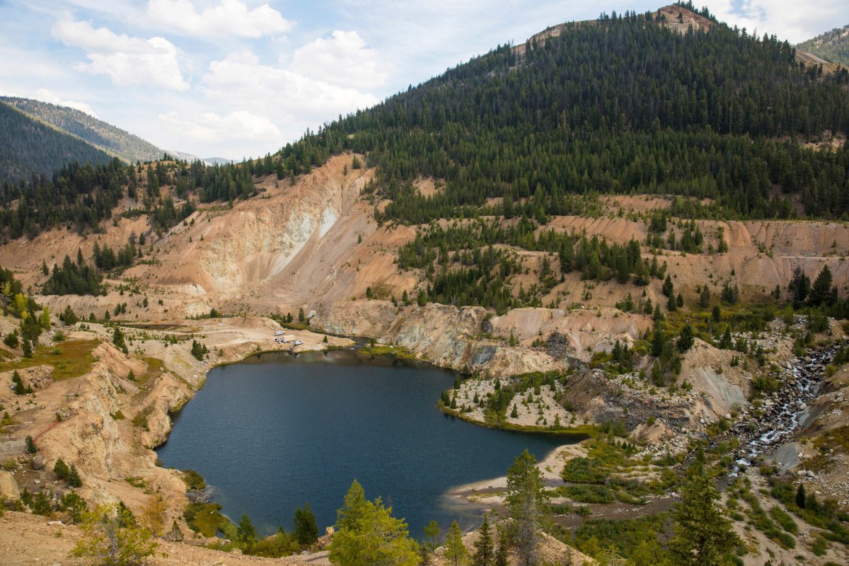 This Sept. 19, 2018 photo shows the Yellow Pine Pit open-pit gold mine in the Stibnite Mining District in central Idaho, where a company hopes to start mining again. Documents show the Trump administration intervening in a U.S. Forest Service decision so that a Canadian company could write a key environmental report on its proposed open-pit gold mines in central Idaho. 