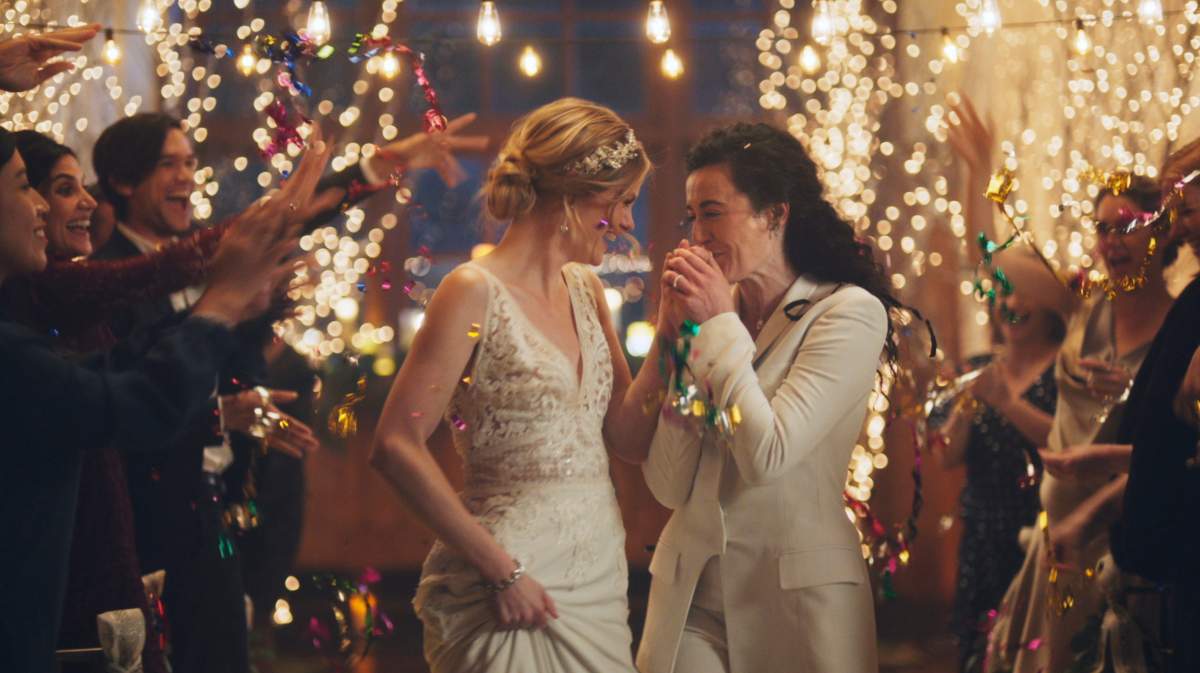 Under pressure from a conservative advocacy group, The Hallmark Channel has pulled the ads for wedding-planning website Zola that featured same-sex couples, including two brides kissing.