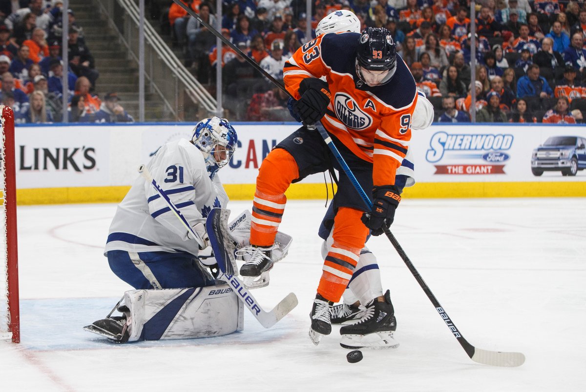 Toronto Maple Leafs goalie Frederik Andersen (31) makes the save as Edmonton Oilers' Ryan Nugent-Hopkins (93) tries to screen during second period NHL action in Edmonton, Alta., on Saturday December 14, 2019. THE CANADIAN PRESS/Jason Franson.