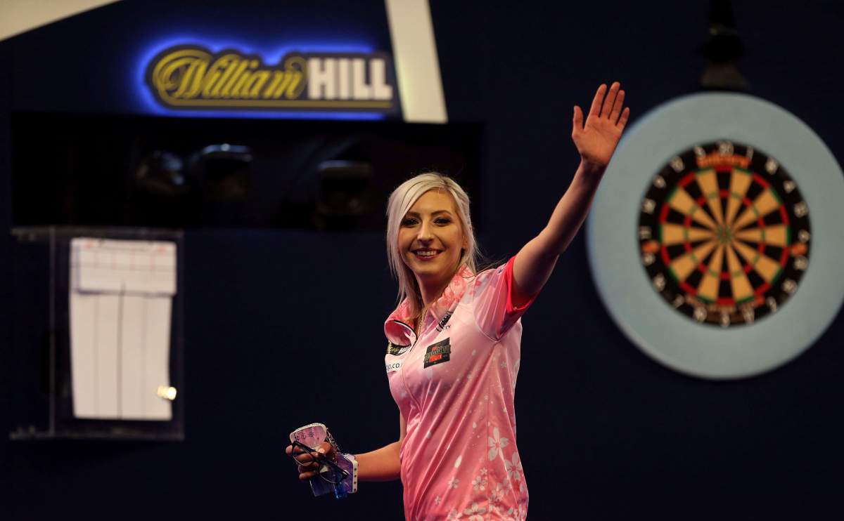 Fallon Sherrock celebrating after becoming the first women to win a game in the PDC Darts World Championship at Alexandra Palace, London, Tuesday Dec. 17, 2019.