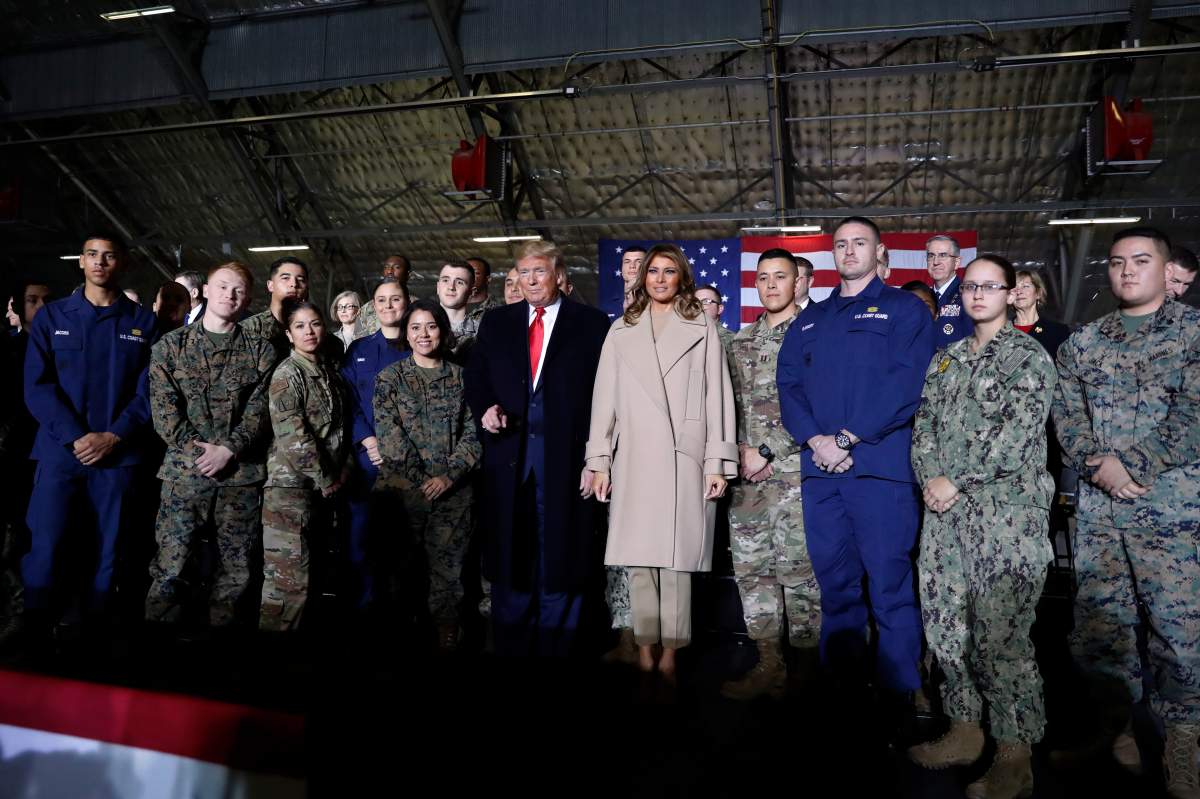 President Donald Trump poses for a photo after signing the National Defence Authorization Act for Fiscal Year 2020 at Andrews Air Force Base, Md., Dec. 20, 2019, before travelling to Mar-a-lago in Palm Beach, Fla.