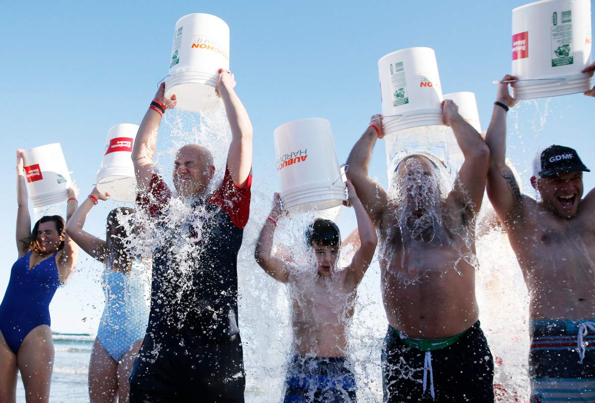 People take the ice bucket challenge during the last Plunge for Pete event on what would have been Pete Frates’ 35th birthday at Good Harbor in Gloucester, Mass., on Dec. 28, 2019.