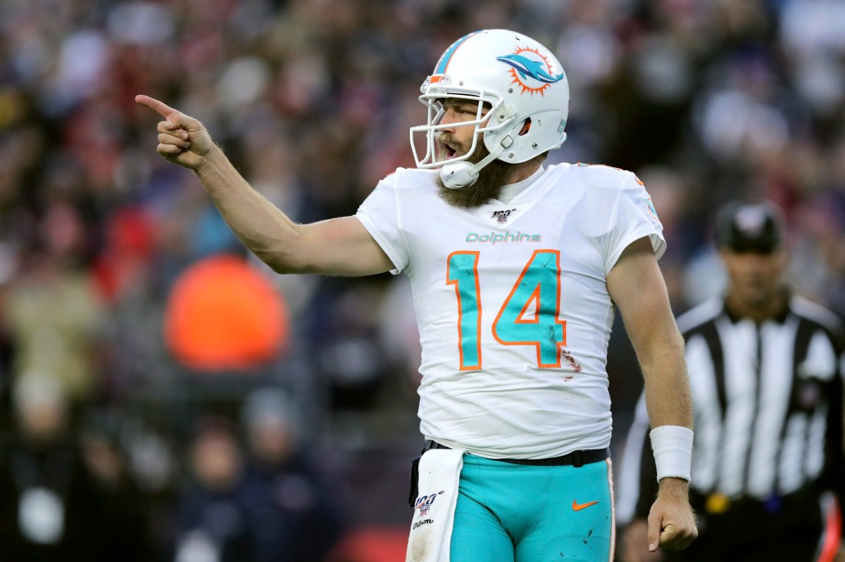 Miami Dolphins quarterback Ryan Fitzpatrick celebrates his winning touchdown pass to Mike Gesicki in the second half of an NFL football game against the New England Patriots, Sunday, Dec. 29, 2019, in Foxborough, Mass.