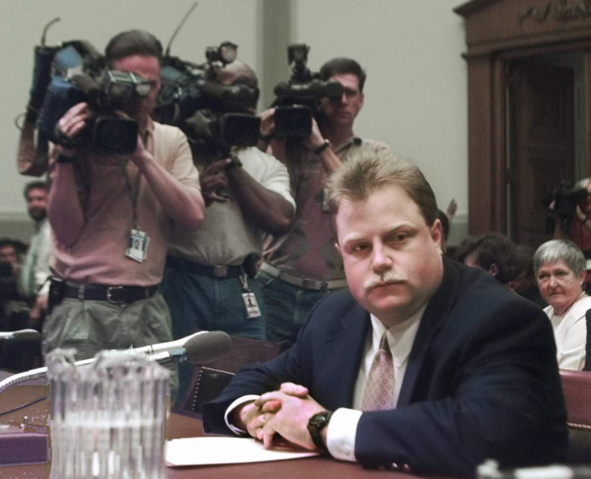 Photographers surround Richard Jewell prior to his testifying before a House Judiciary Crime subcommittee hearing on the 1996 Olympic bombing in Atlanta, July 30, 1997.