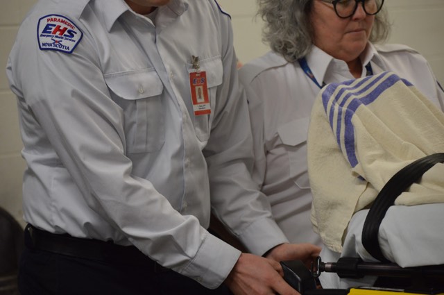 Nova Scotia paramedics use a new power loader during a demonstration on Dec. 18, 2019.