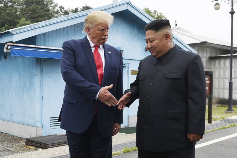 FILE - In this June 30, 2019 file photo, President Donald Trump meets with North Korean leader Kim Jong Un at the border village of Panmunjom in the Demilitarized Zone, South Korea. President Donald Trump starts the new year knee-deep in daunting foreign policy challenges at the same time he'll have to deal with a likely impeachment trial in the Senate and the demands of a reelection campaign. 