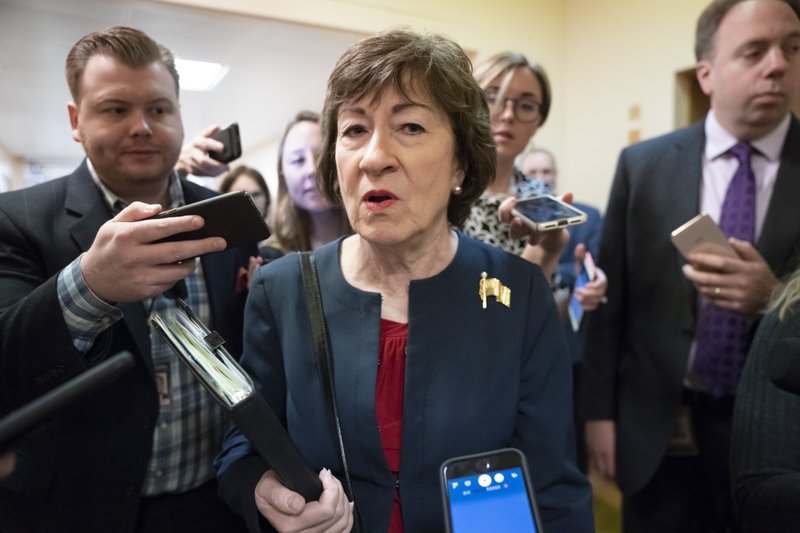 FILE - In this Nov. 6, 2019, file photo, Sen. Susan Collins, R-Maine, is surrounded by reporters as she heads to vote at the Capitol in Washington. U.S. Sen. Collins officially launched her bid for a reelection Wednesday, Dec. 18, setting up an expensive and closely watched battle for the seat the moderate Republican from Maine has held for nearly 24 years. 