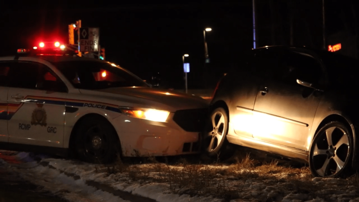 N.B. man facing 16 charges, accused of robbery and hitting RCMP officer with vehicle - image