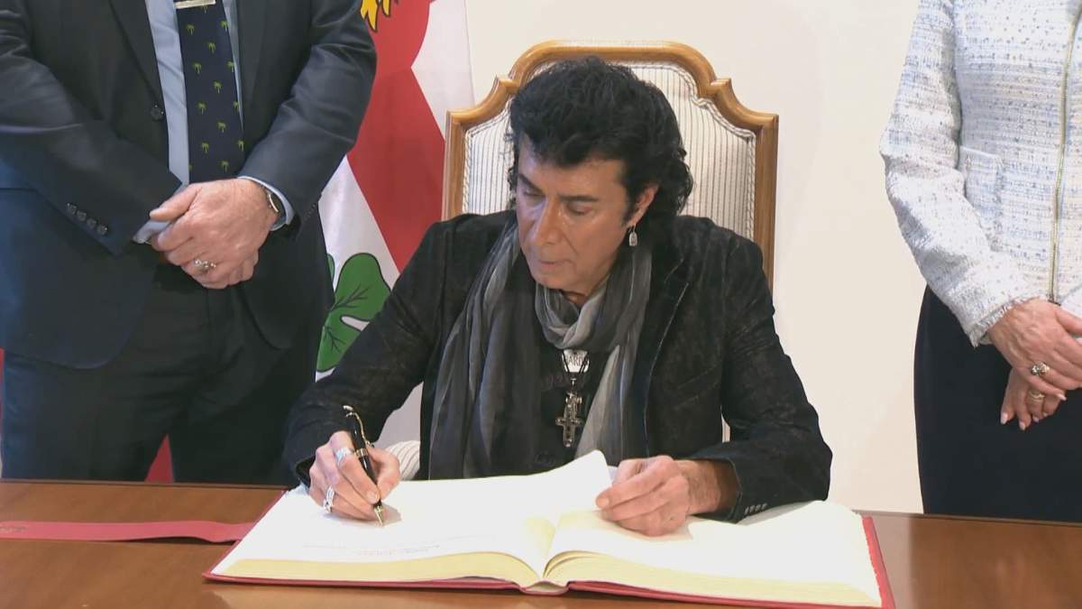 Singer song-writer Andy Kim signs Montreal's golden book.